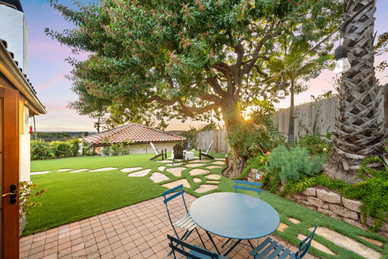 Table and chairs in the yard of a residential property